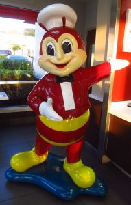 jollibee figurine in front of a dubai branch